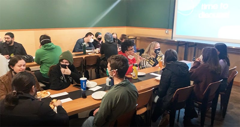Pizza and Politics Students discuss politics over pizza